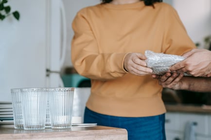 Woman wrapping glass